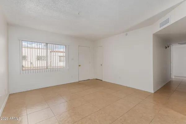 a view of an empty room with a window