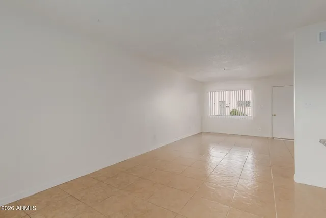 a view of an empty room and window