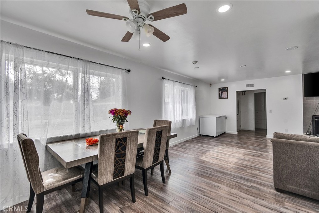 5121 Sierra Street Riverside, CA 92504 - Photo 29 of 34 a view of a dining room with furniture window and wooden floor