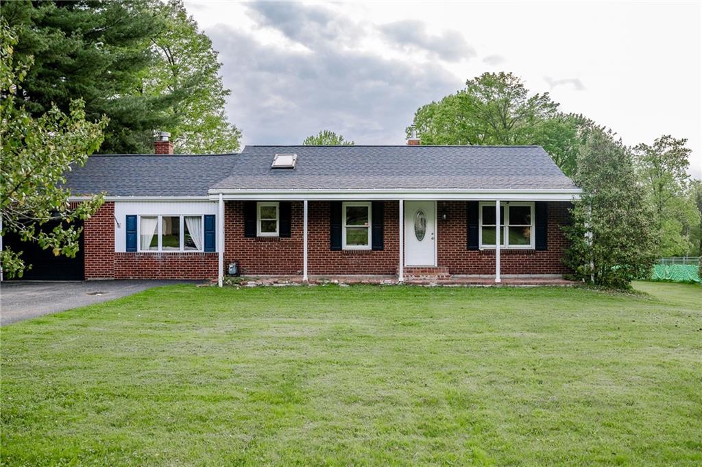 128 Steppland Road Butler, PA 16002 - Photo 1 of 14 a front view of a house with a garden