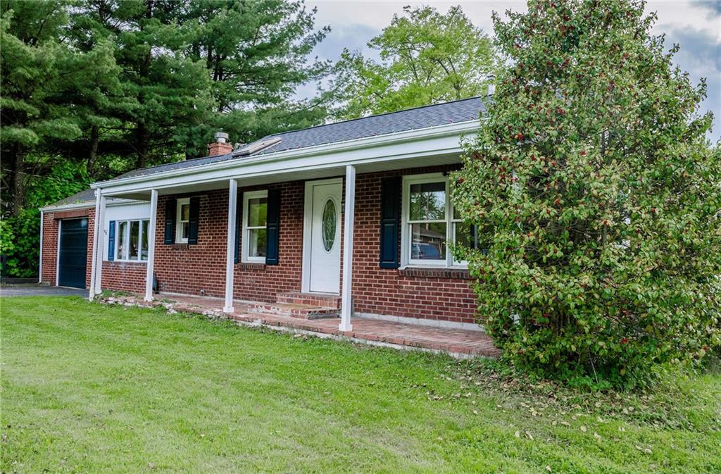 128 Steppland Road Butler, PA 16002 - Photo 2 of 14 a view of a house with porch and garden