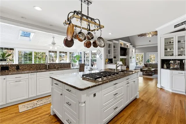 a dining room with furniture wooden floor and a rug