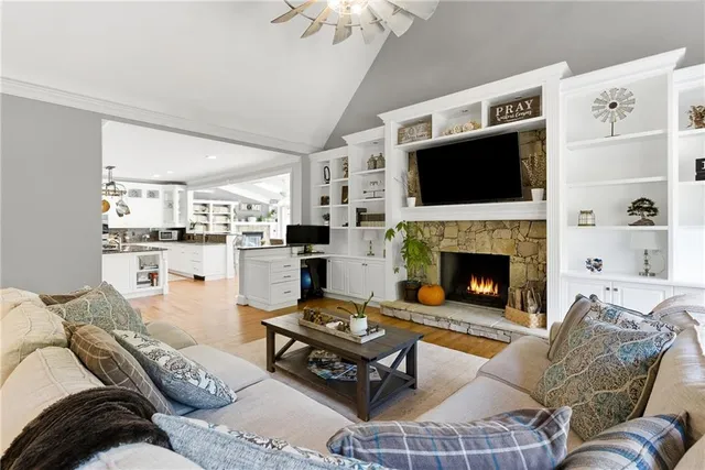 a bedroom with a bed window and a fireplace