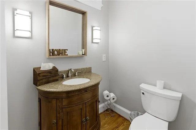 a view of a bathroom with a sink a mirror and a shower
