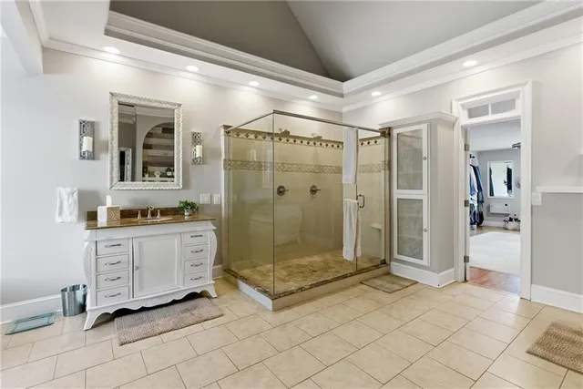 a bedroom with furniture and a large window