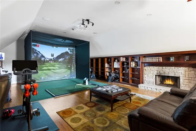 a living room with furniture and a ceiling fan