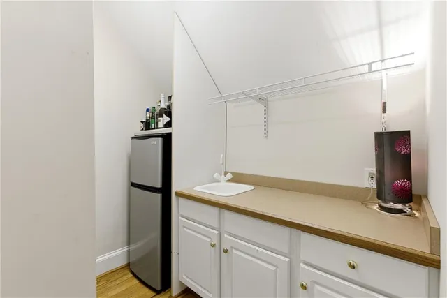 a view of a livingroom with furniture and a window