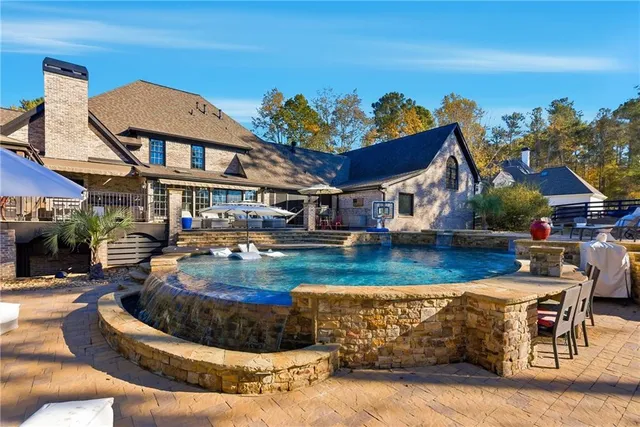 a view of staircase with wooden floor and a large window
