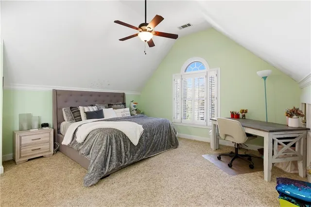 a view of a patio with table and chairs
