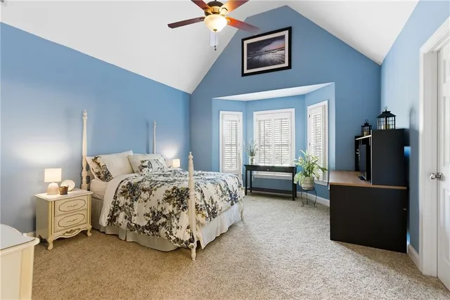 a view of a patio with table and chairs under an umbrella with wooden floor