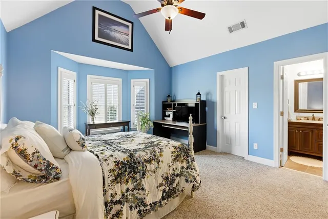 a view of living room filled with furniture and floor to ceiling window