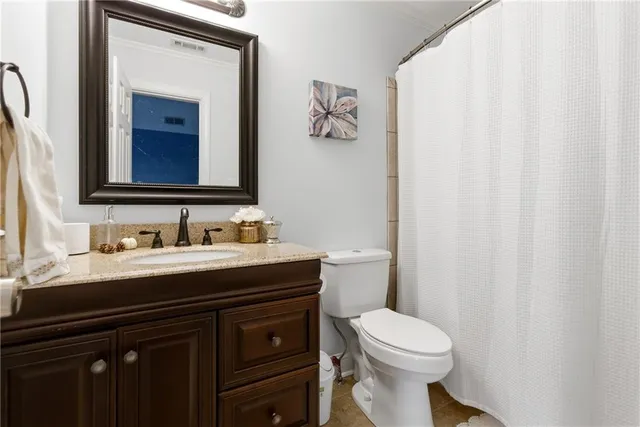 a view of a patio with dining table and chairs with a barbeque grill and plants