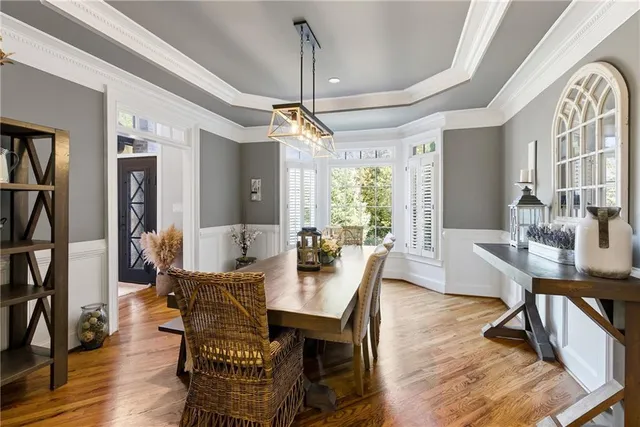 a kitchen with stainless steel appliances granite countertop a stove and cabinets