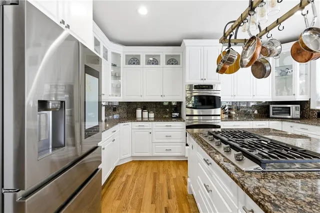 a living room with furniture and a book shelf