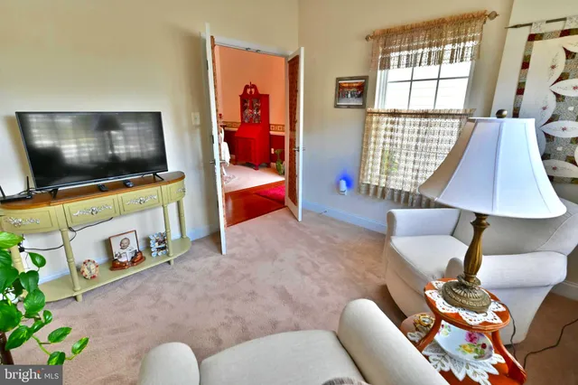a large living room with furniture and a flat screen tv