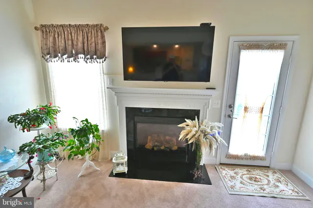 a living room with furniture chess board and a couch