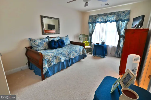 a view of a house with backyard sitting area and garden