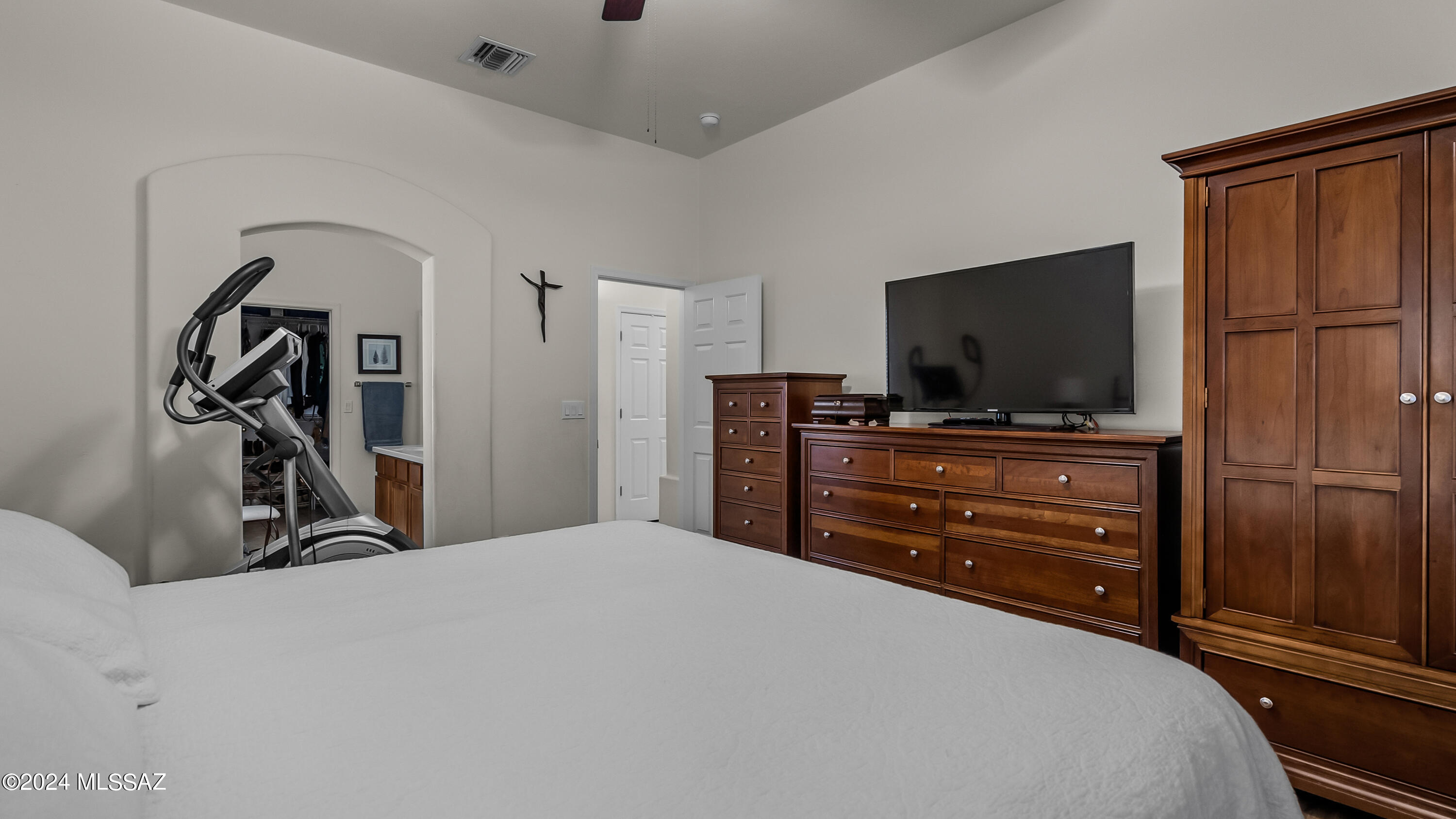 374 Via Capri Rio Rico, AZ 85648 - Photo 25 of 30 a bedroom with a dresser and flat screen tv