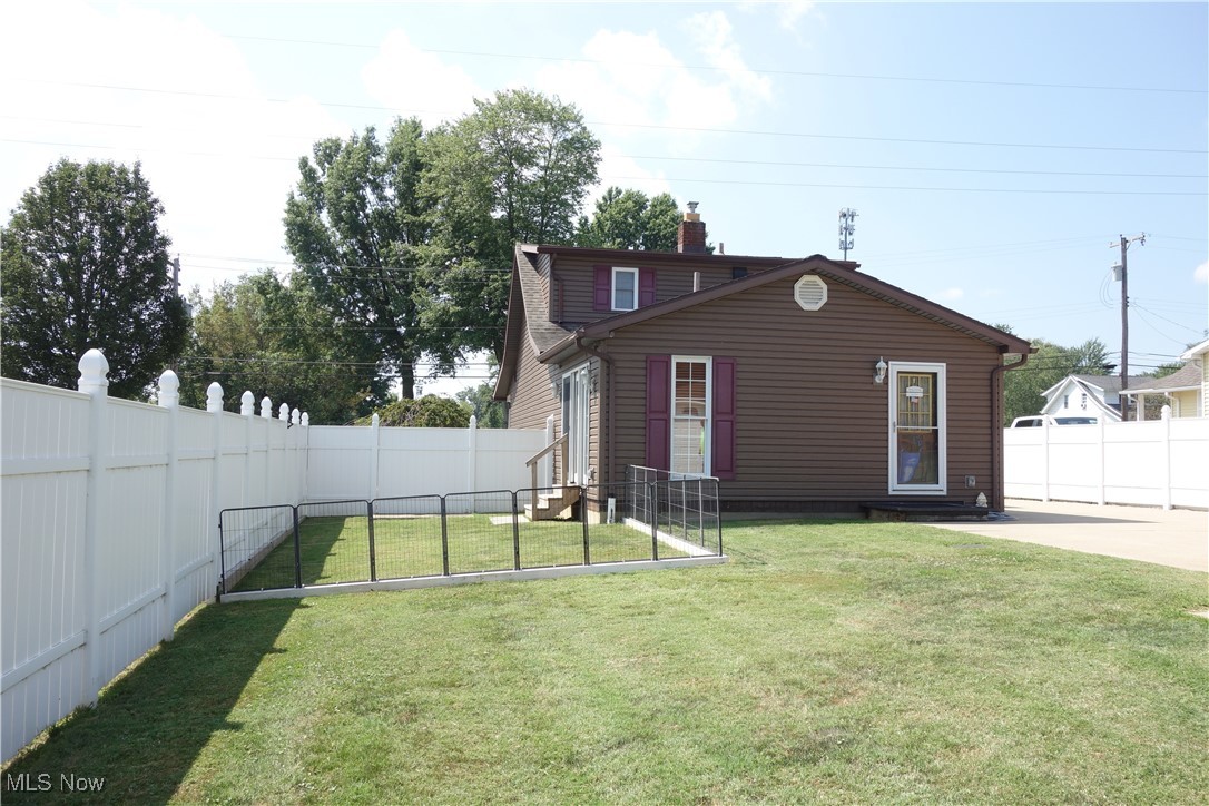 955 Center Road Clinton, OH 44216 - Photo 34 of 40 Fenced area for your fur babies OR maybe your garden here in this great big yard