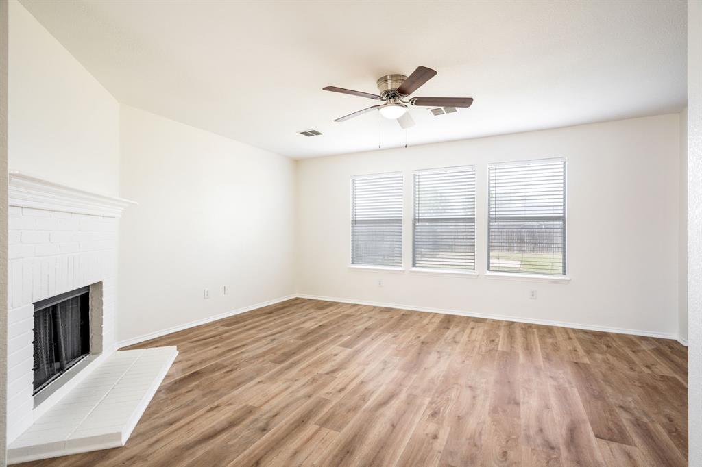 1626 White Oak Road Anna, TX 75409 - Photo 17 of 30 a view of empty room with wooden floor and fan