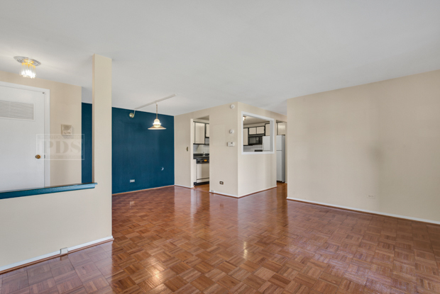 1114 Springinsguth Road, Unit 2A Schaumburg, IL 60193 - Photo 6 of 19 a view of empty room with wooden floor