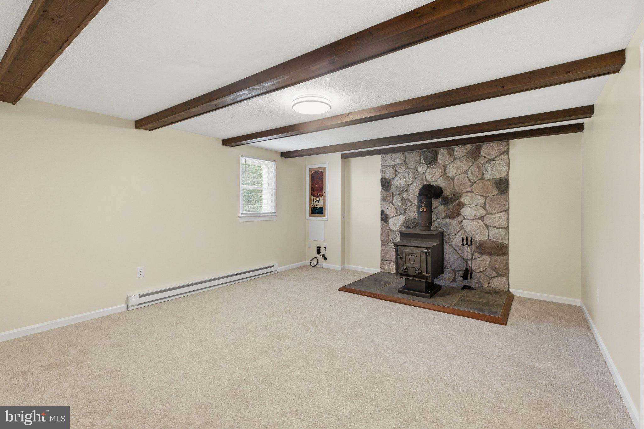 3624 Kemptown Church Road Monrovia, MD 21770 - Photo 5 of 68 Spacious rustic family room with woodstove.