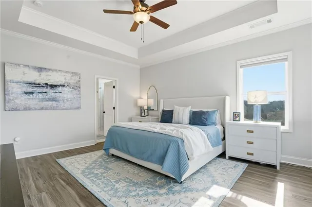 a view of walk in closet with clothes