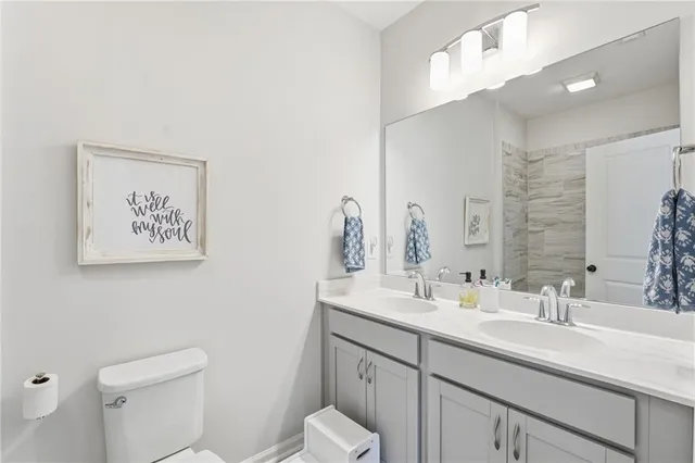 a bedroom with a bed a desk and chair