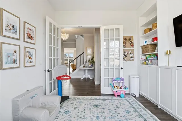 a view of a workspace with furniture and a window