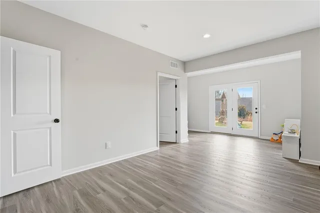 a view of a lake with a house in the background