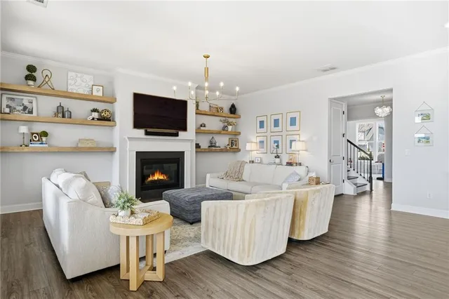 a large kitchen with lots of counter space and wooden floor