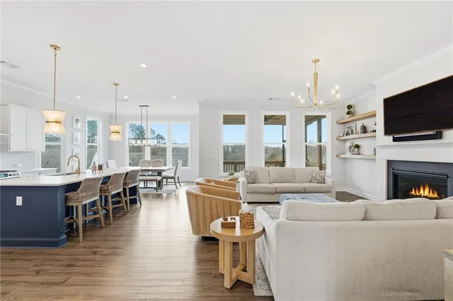 a large kitchen with a table and chairs