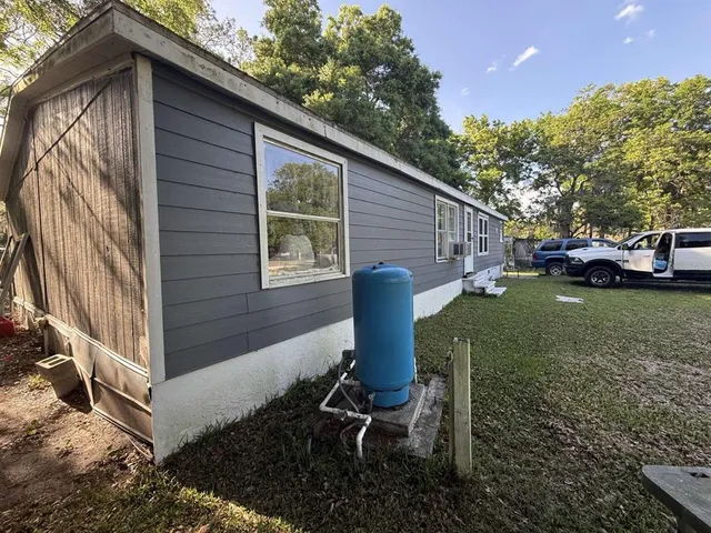 a view of backyard with sitting area