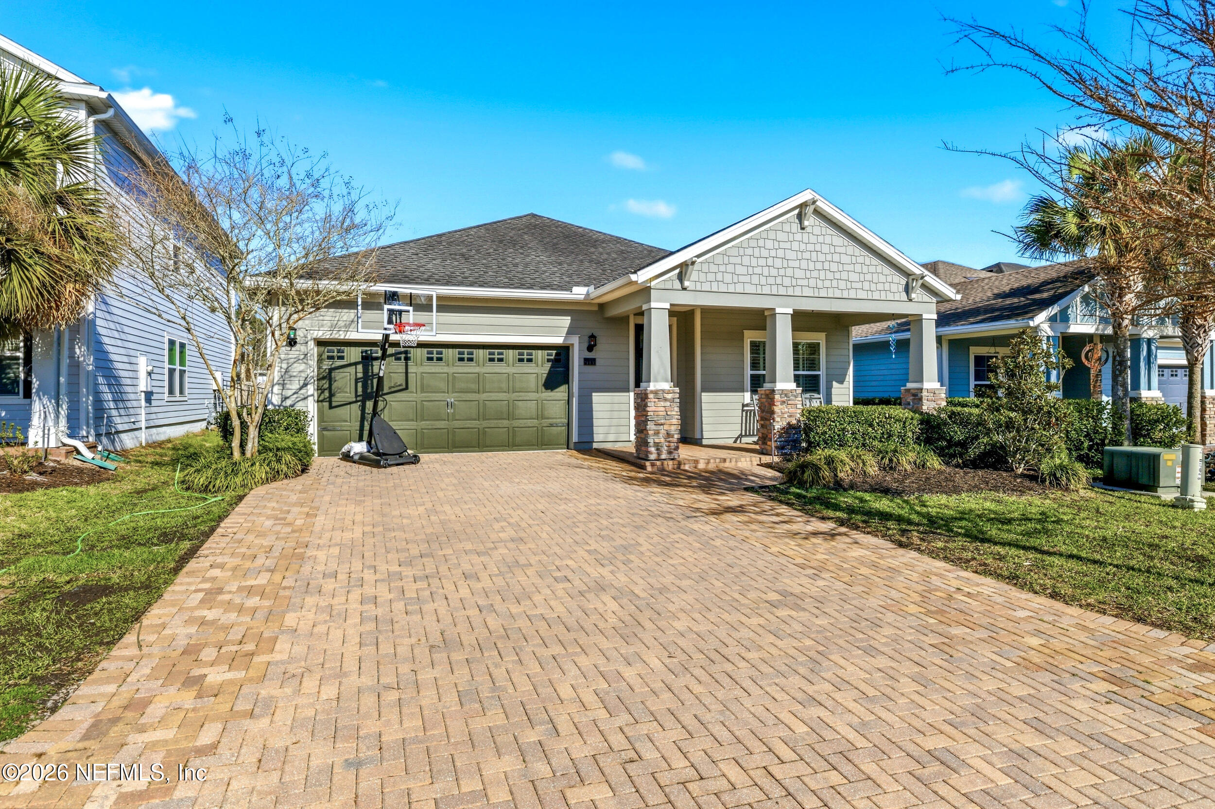 113 Howell Court St. Augustine, FL 32092 - Photo 1 of 63 a front view of a house with a yard and garage