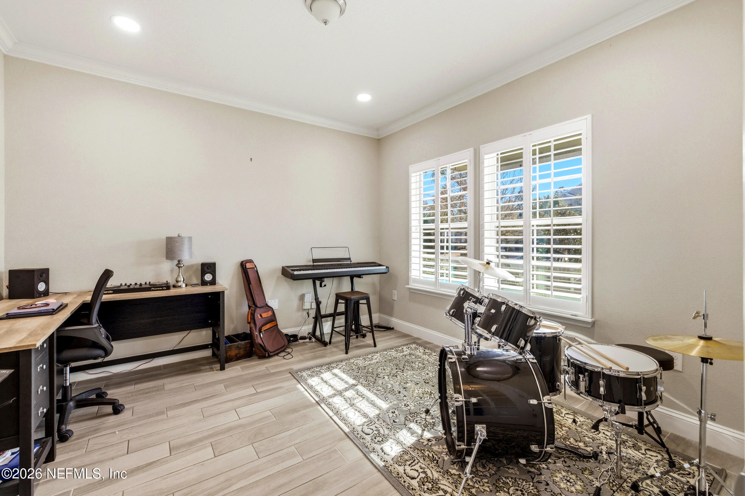 113 Howell Court St. Augustine, FL 32092 - Photo 23 of 63 a view of a workspace with furniture and a window