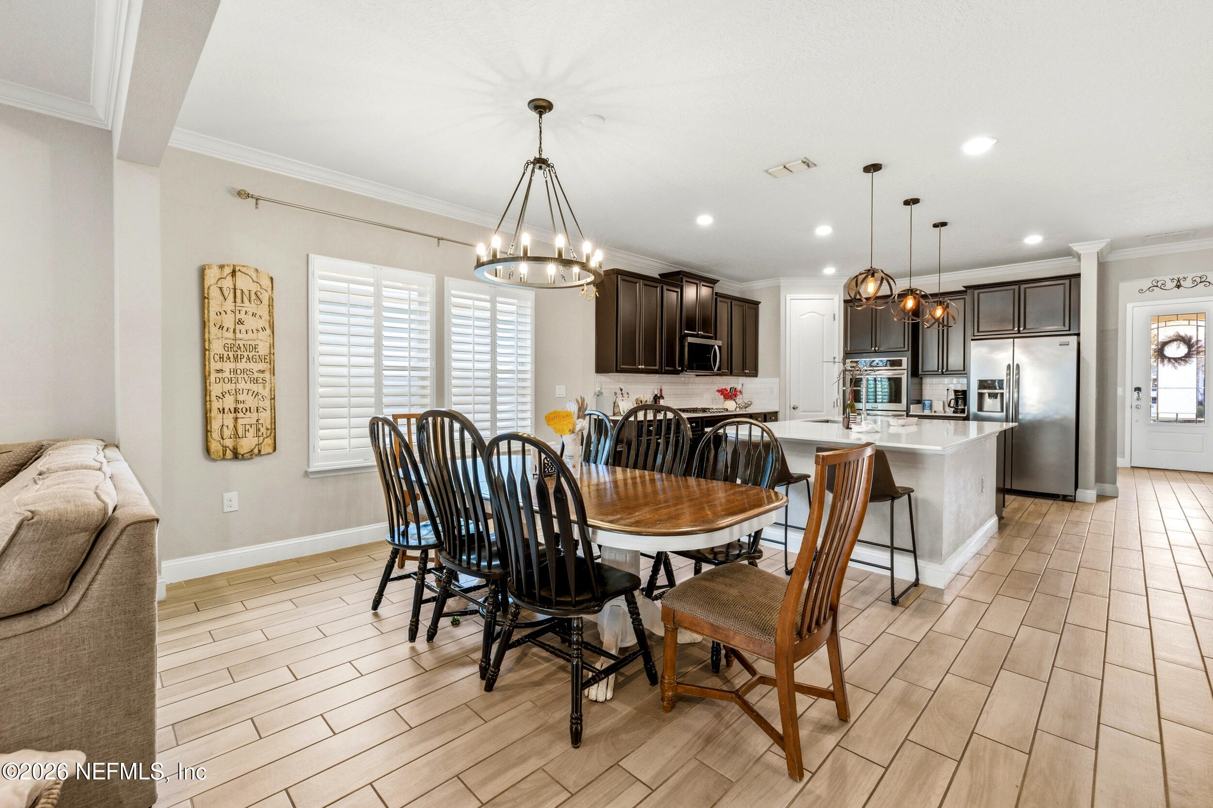 113 Howell Court St. Augustine, FL 32092 - Photo 28 of 63 a view of a dining room with furniture window and wooden floor