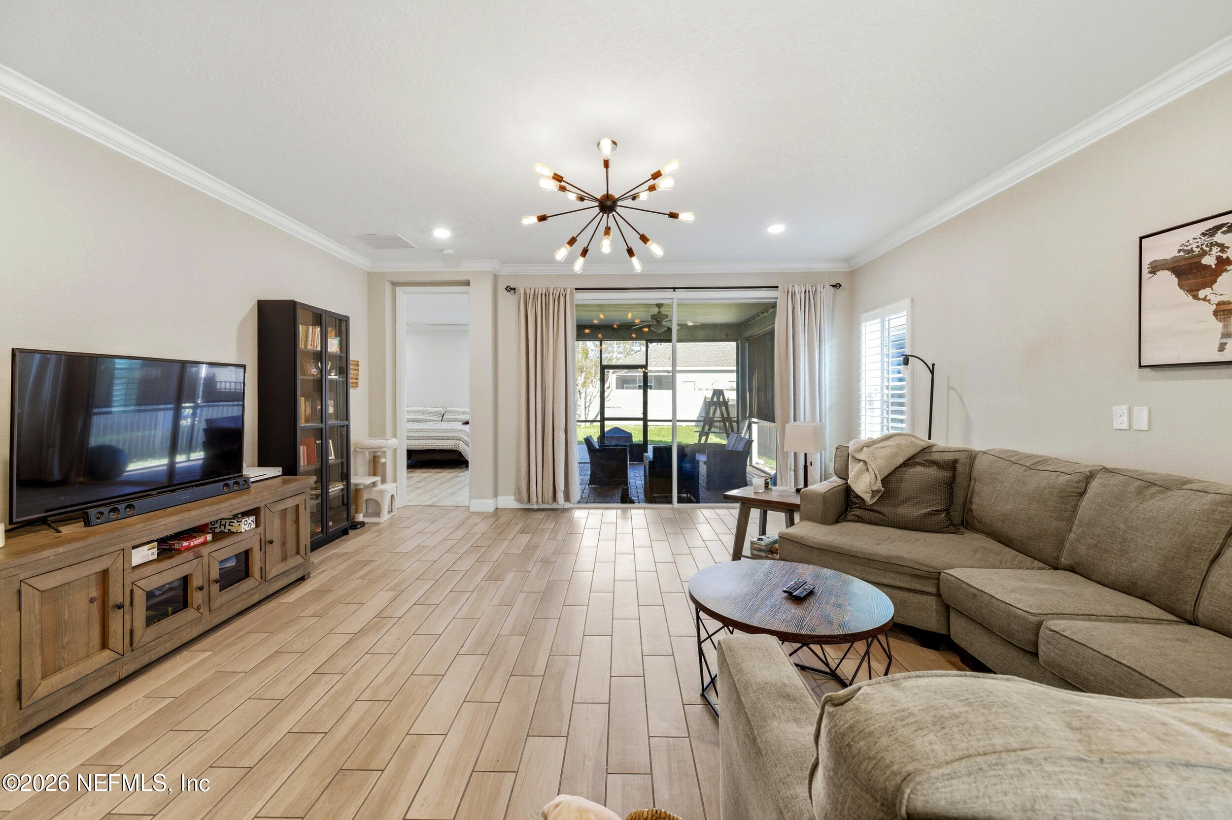 113 Howell Court St. Augustine, FL 32092 - Photo 29 of 63 a living room with furniture and a flat screen tv