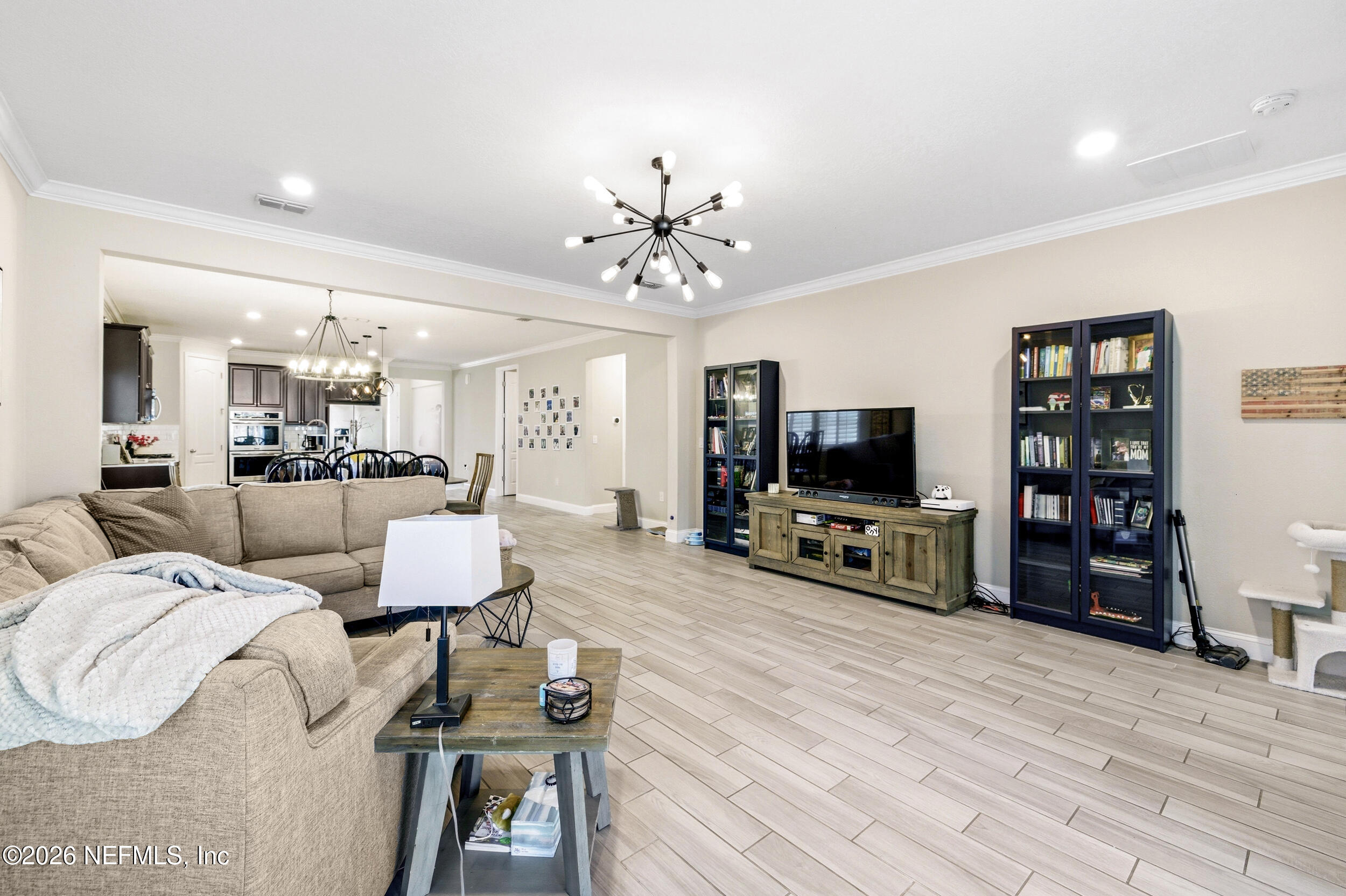 113 Howell Court St. Augustine, FL 32092 - Photo 31 of 63 a living room with furniture and a flat screen tv