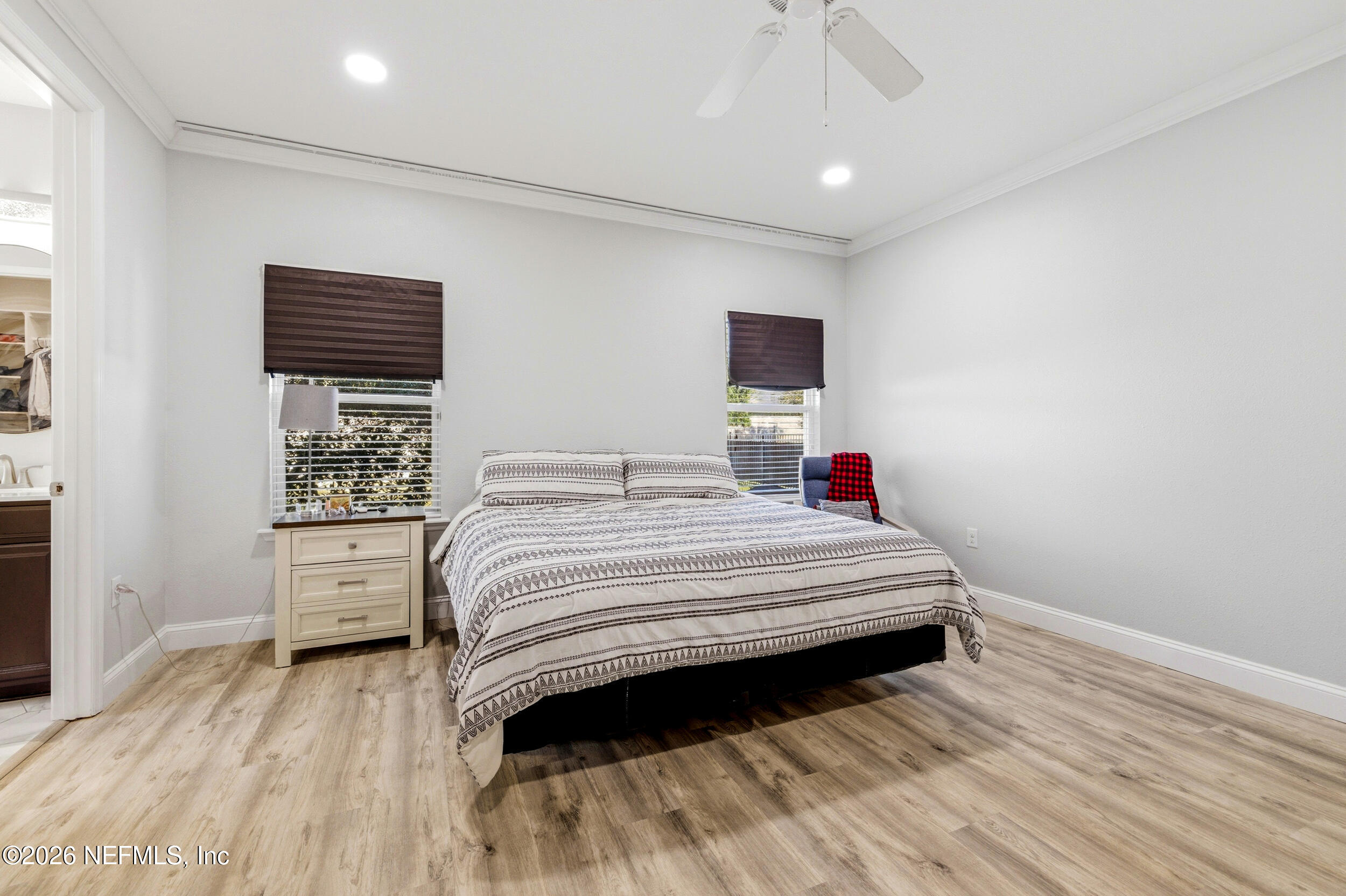 113 Howell Court St. Augustine, FL 32092 - Photo 34 of 63 a bedroom with a bed and a night stand