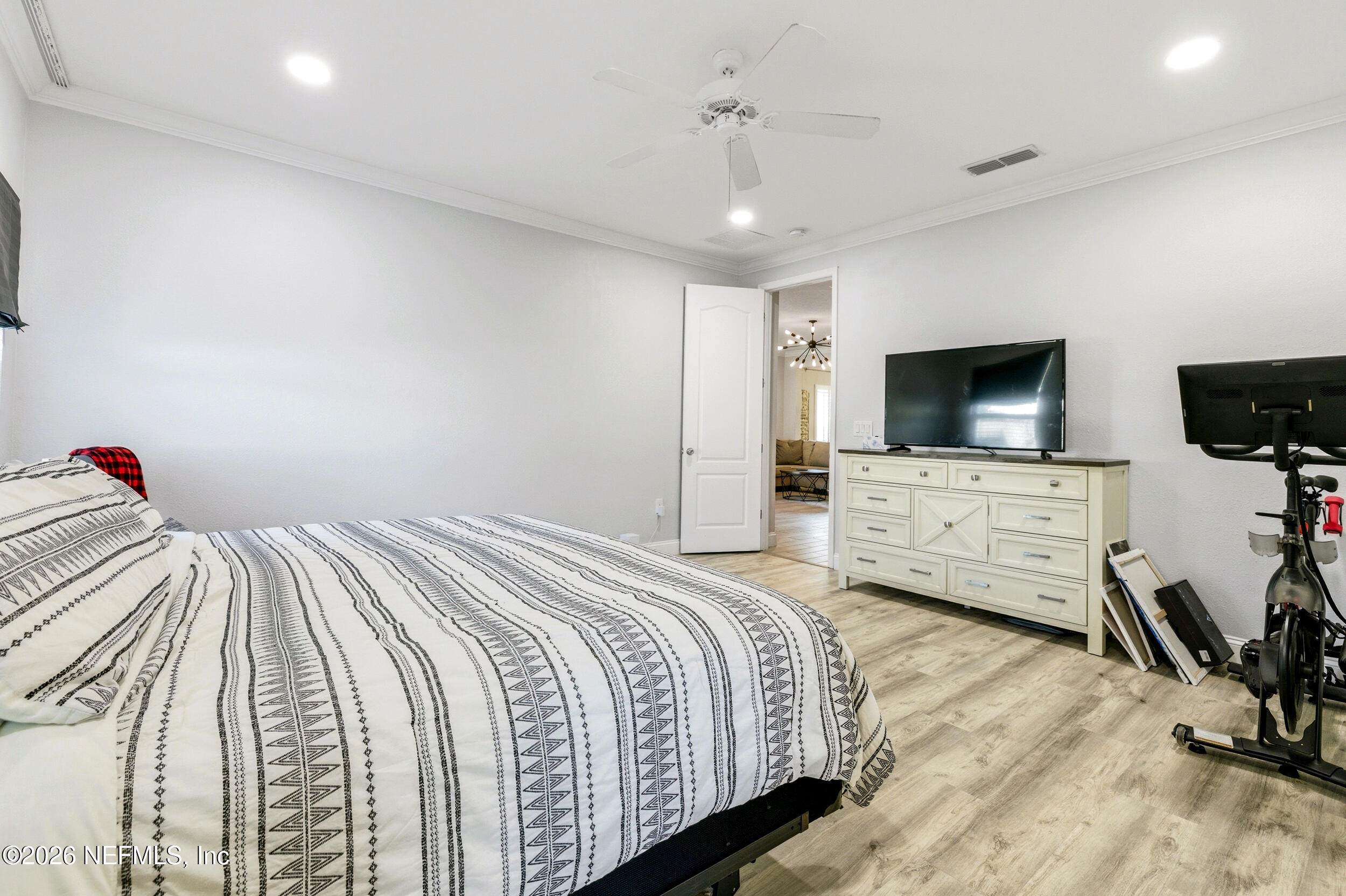 113 Howell Court St. Augustine, FL 32092 - Photo 35 of 63 a bedroom with a bed and a flat screen tv