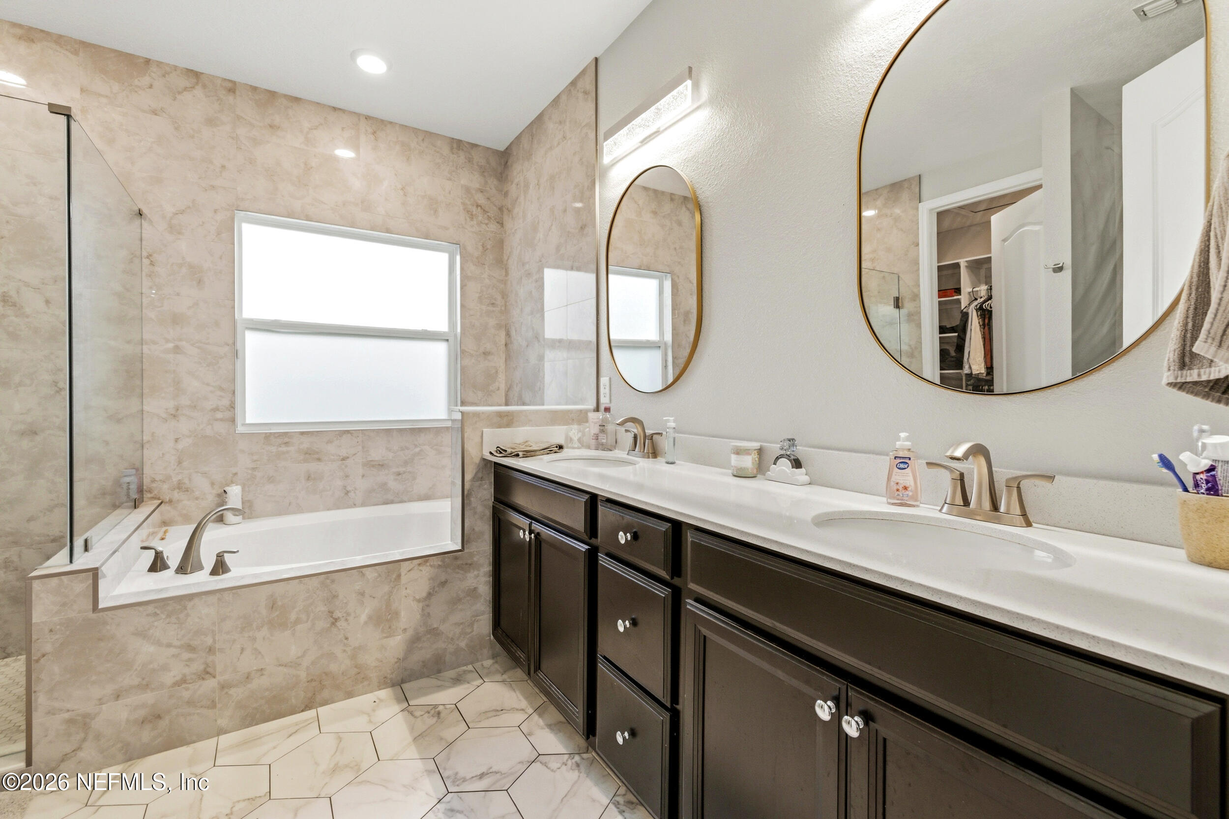 113 Howell Court St. Augustine, FL 32092 - Photo 36 of 63 a bathroom with a double vanity sink mirror and bathtub