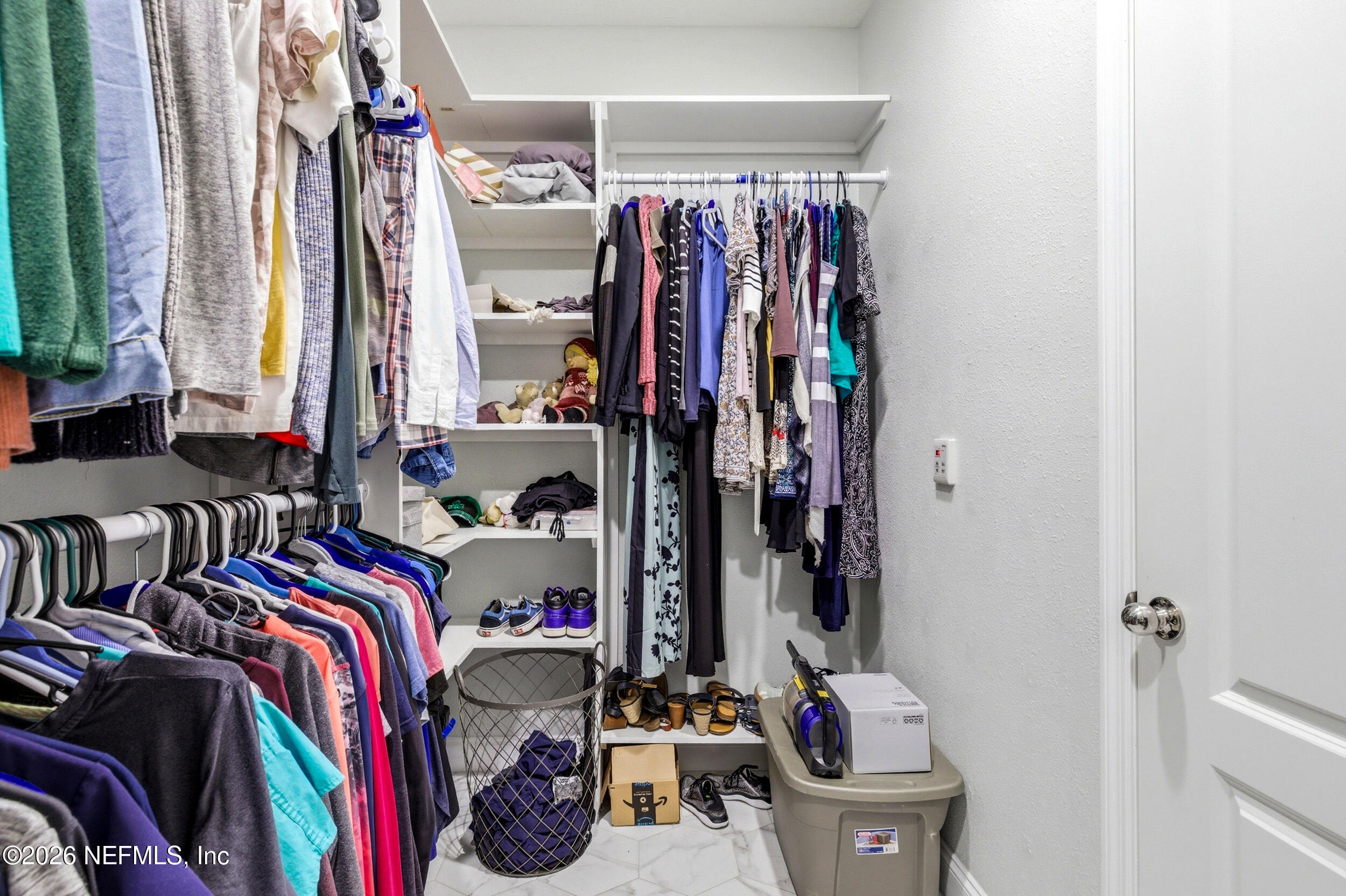 113 Howell Court St. Augustine, FL 32092 - Photo 39 of 63 a view of walk in closet with clothes and shoes