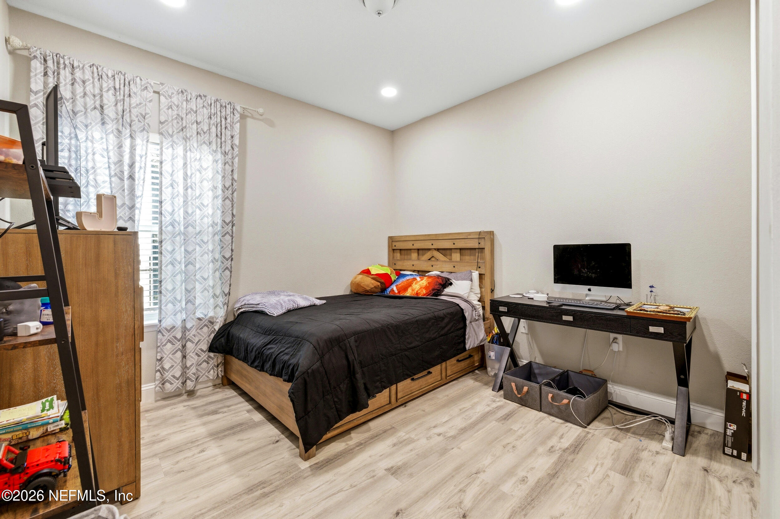 113 Howell Court St. Augustine, FL 32092 - Photo 42 of 63 a bedroom with a bed and a flat screen tv