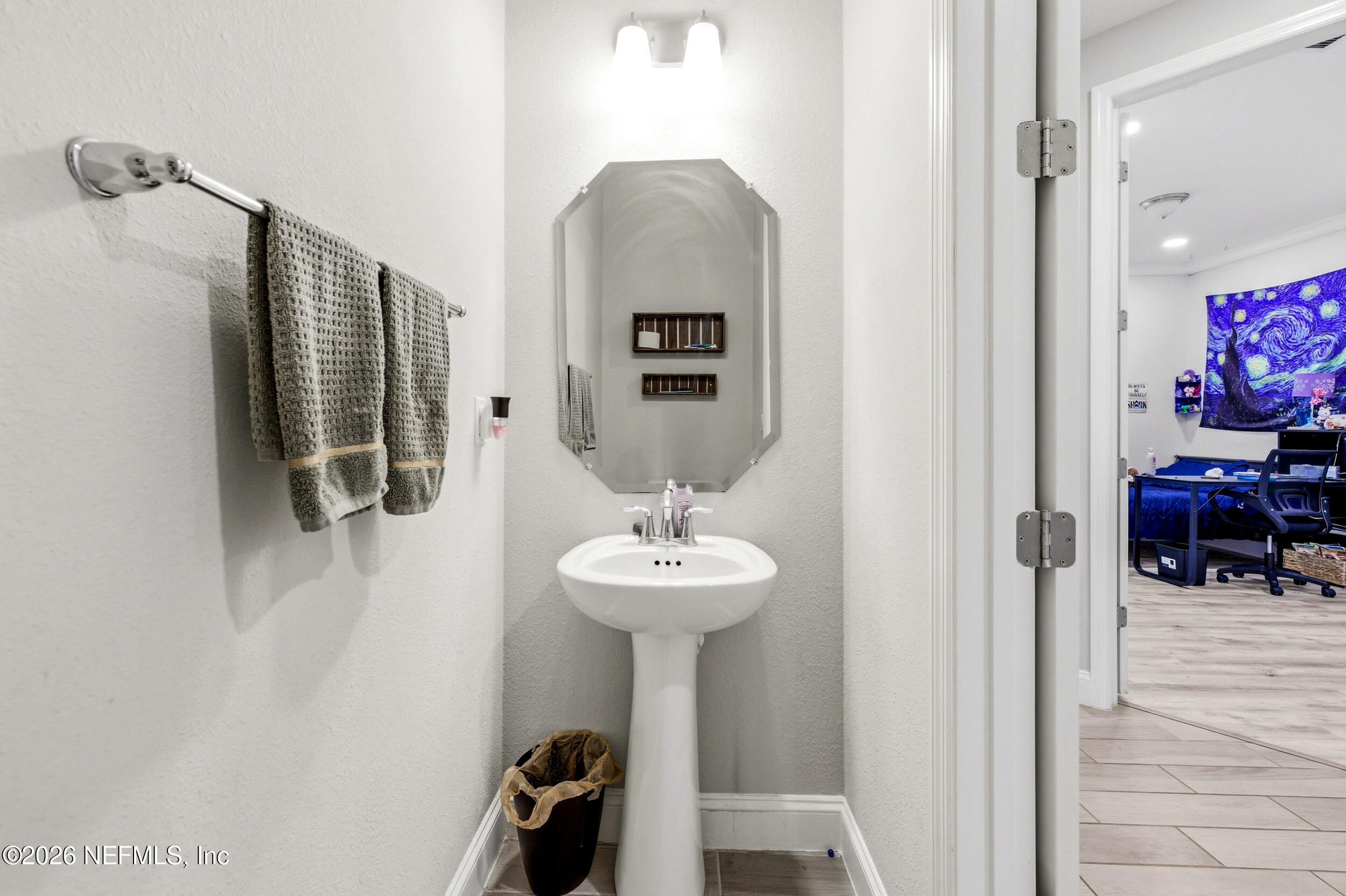 113 Howell Court St. Augustine, FL 32092 - Photo 45 of 63 a bathroom with a sink and a mirror