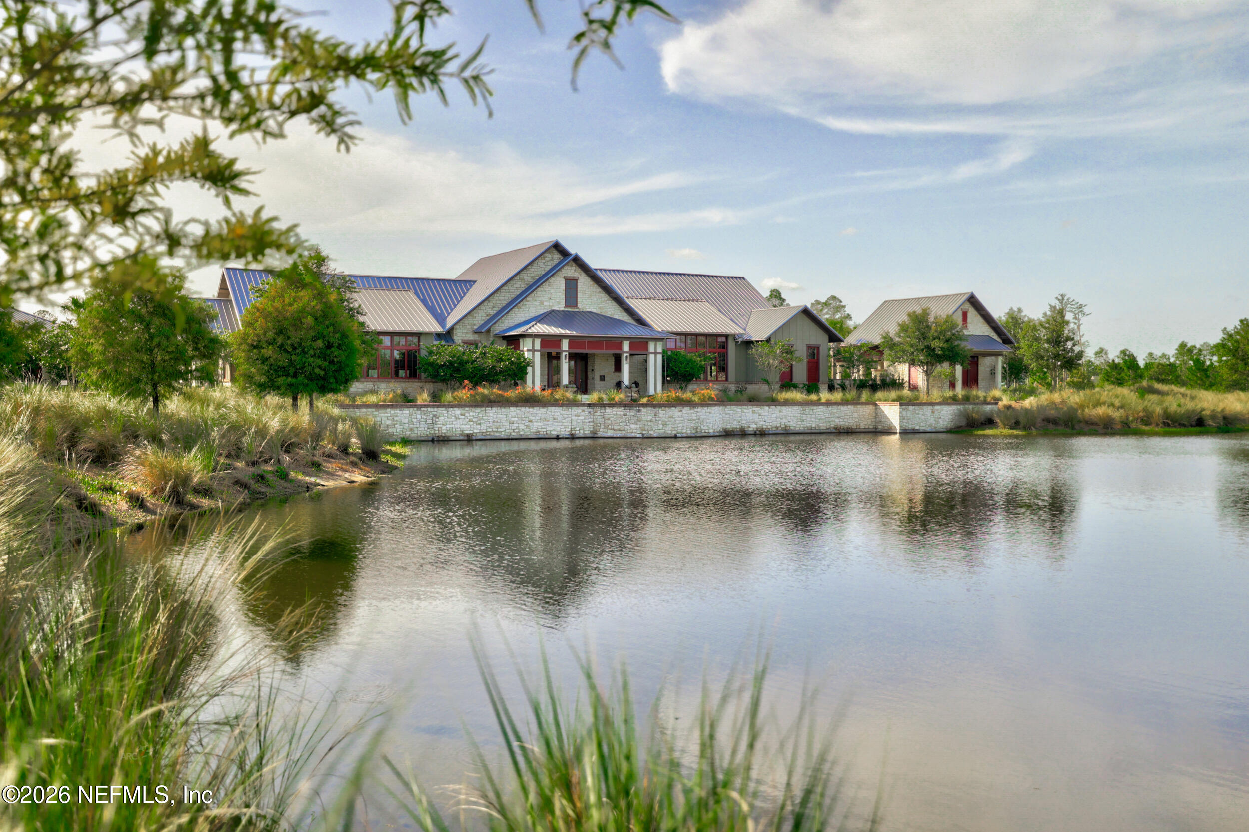 113 Howell Court St. Augustine, FL 32092 - Photo 46 of 63 a front view of a house with a lake view