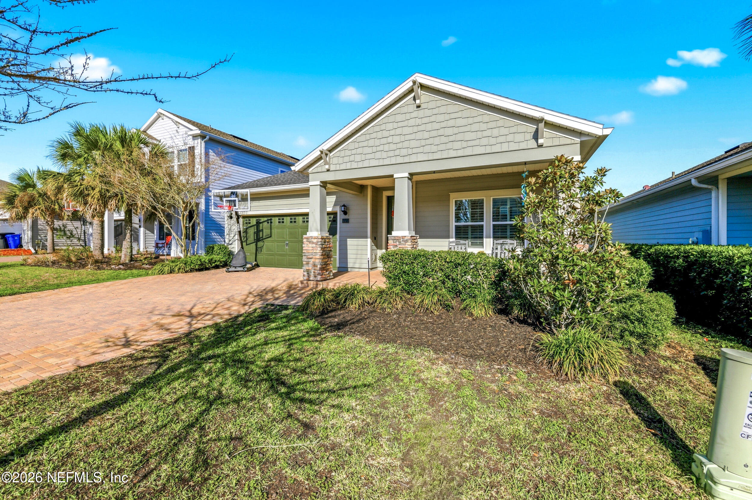 113 Howell Court St. Augustine, FL 32092 - Photo 8 of 63 a view of a house with a small yard and potted plants