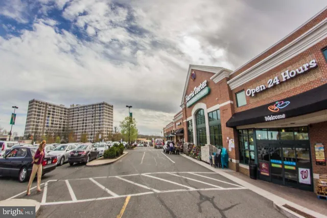 a view of a building with car parked