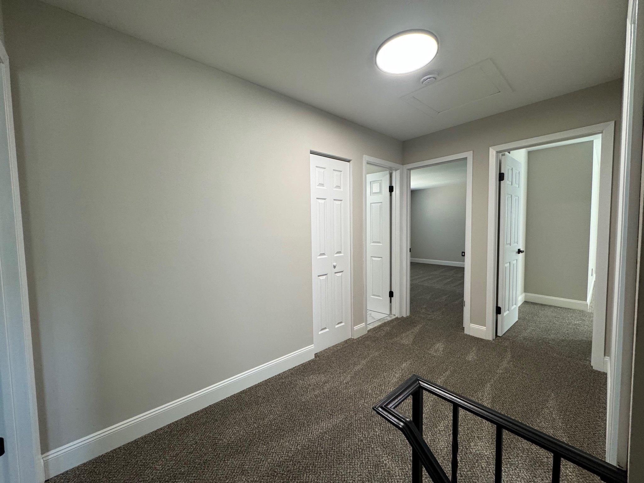 8 Framingham Road Beverly, NJ 08010 - Photo 24 of 35 a view of a hallway with wooden floor