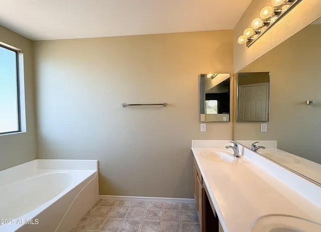 a bathroom with a sink and a bathtub