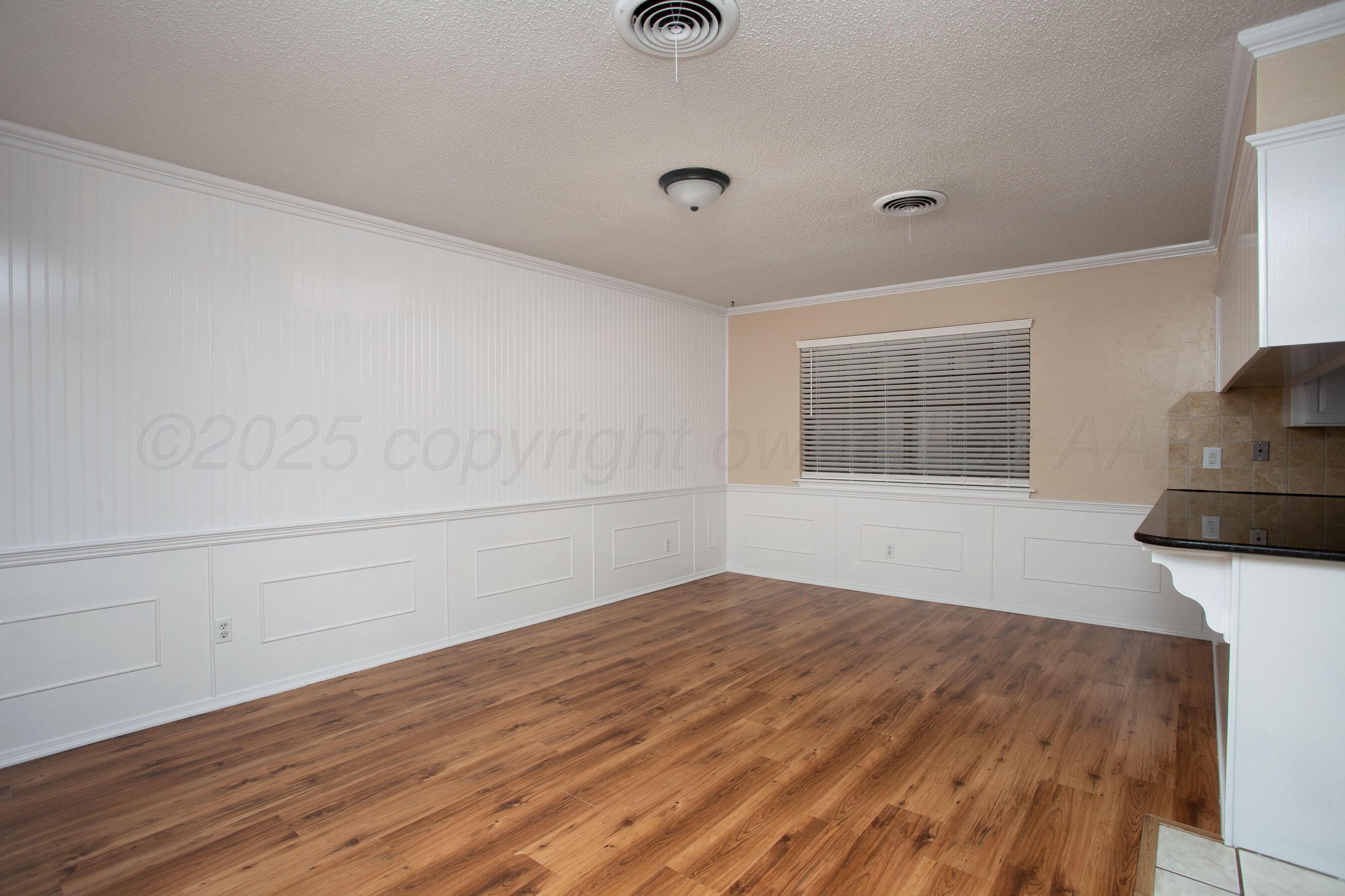 3529 Cinderella Lane Amarillo, TX 79121 - Photo 11 of 33 a view of empty room with wooden floor and fan
